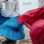 Photo by Luis Quintero: https://www.pexels.com/photo/women-wearing-traditional-outfits-dancing-on-a-street-18253291/